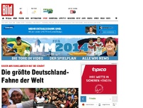 Bild zum Artikel: Bauer aus Bangladesch - ER näht 3500 Meter lange Deutschlandfahne