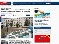 Bild zum Artikel: Krawall in Flüchtlingsheim - 50 Flüchtlinge attackieren Polizisten mit Steinen und Eisenstangen – 13 Verletzte