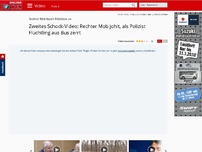 Bild zum Artikel: Rechter Mob feuert Polizisten an - Zweites Schock-Video: Rechter Mob johlt, als Polizist Flüchtling aus Bus zerrt