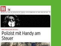 Bild zum Artikel: Nanü-nana, darf der das? - Polizist mit Handy am Steuer