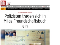 Bild zum Artikel: Milas neue Freunde - Polizisten tragen sich in gefundenes Buch ein