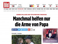 Bild zum Artikel: Robbie Williams Tochter - Manchmal helfen nur die Arme von Papa