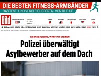 Bild zum Artikel: Er randalierte, warf Steine - Polizei überwältigt Asylbewerber auf dem Dach