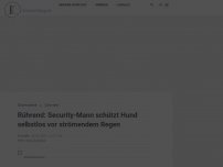 Bild zum Artikel: Rührend: Security-Mann schützt Hund selbstlos vor strömendem Regen