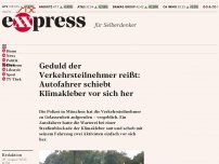 Bild zum Artikel: Geduld der Verkehrsteilnehmer reißt: Autofahrer schiebt Klimakleber vor sich her