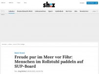 Bild zum Artikel: Freude pur im Meer vor Föhr: Menschen im Rollstuhl paddeln auf SUP-Board