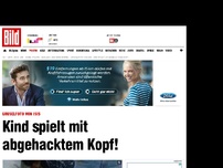 Bild zum Artikel: Gruselfoto von ISIS - Kind spielt mit abgehacktem Kopf!