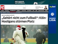 Bild zum Artikel: „Gehört nicht zum Fußball“: Köln-Hooligans stürmen Platz Nach dem Last-Minute-Gegentor bei Borussia Mönchengladbach haben vermummte Hooligans des 1. FC Köln den Platz im Borussia-Park gestürmt. »