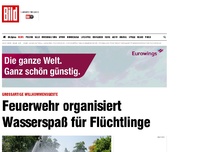 Bild zum Artikel: Freiwillige Feuerwehr - Flüchtlinge freuen sich über Wasserspaß