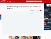 Bild zum Artikel: 300 Personen sollten dort wohnen - Brand in Flüchtlingsunterkunft: Gaffer jubeln und behindern Feuerwehr