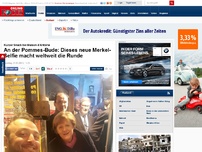 Bild zum Artikel: Kurzer Snack bei Maison d'Antoine - An der Pommes-Bude: Dieses neue Merkel-Selfie macht weltweit die Runde