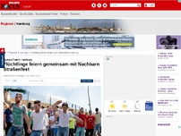Bild zum Artikel: Buntes Fest in Hamburg - Flüchtlinge feiern gemeinsam mit Nachbarn Straßenfest