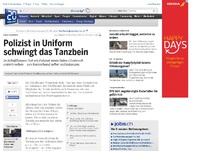 Bild zum Artikel: Salsa-Flashmob: Polizist in Uniform schwingt das Tanzbein