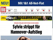 Bild zum Artikel: Papp-Figur in der Kabine - Sylvie strippt für die Roten