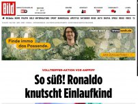 Bild zum Artikel: Volltreffer vor Anpfiff - So süß! Ronaldo knutscht Einlaufkind