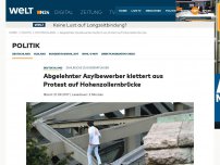 Bild zum Artikel: Zahlreiche Zugverspätungen: Abgelehnter Asylbewerber klettert aus Protest auf Hohenzollernbrücke