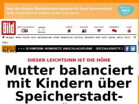 Bild zum Artikel: Hamburg-Speicherstadt - Mutter balanciert mit Kindern über Brücke