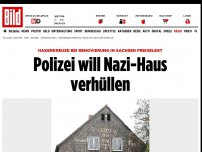 Bild zum Artikel: Hakenkreuze freigelegt - Polizei will Nazi-Haus verhüllen