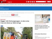 Bild zum Artikel: Nach Unfall - Bagger hält Rettungswagen, in dem eine Frau ein Kind zur Welt bringt