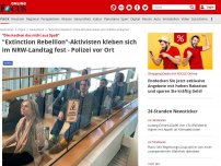 Bild zum Artikel: 'Die machen das nicht aus Spaß' - 'Extinction Rebellion'-Aktivisten kleben sich im NRW-Landtag fest - Polizei vor Ort