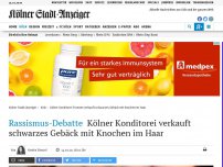 Bild zum Artikel: Rassismus-Debatte: Kölner Konditorei verkauft schwarzes Gebäck mit Knochen im Haar