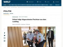 Bild zum Artikel: Polizei trägt Abgeordneten Fiechtner aus dem Landtag