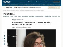 Bild zum Artikel: Kabelbinder um den Hals - Umweltaktivist kettet sich an Pfosten