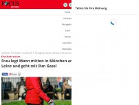 Bild zum Artikel: Eine Stadt staunt - Frau legt Mann mitten in München an die Leine und geht mit ihm Gassi